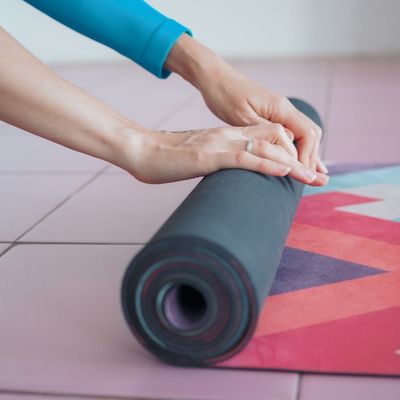 A calm and peaceful yoga mat rolled out, ready for practice.