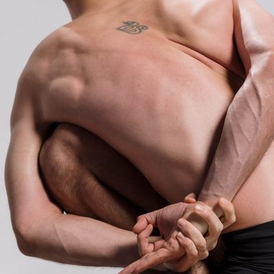 A strong posture showing back muscles during a yoga practice.